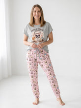 Women wearing cozy knit two-piece pajama set with French Bulldog and coffee graphic print in pink and gray