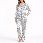 Women's white pajama set with blue wedding-themed doodle pattern, featuring wedding cars, cakes, churches, rings, and 'We're Gonna Get Married' text, perfect for bridal showers or bachelorette parties.