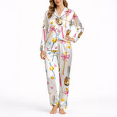Women's pajama set featuring a cute watercolor print of pink and blue baseball bats, yellow softballs, brown gloves, and scattered hearts on a white background.