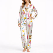 Women's pajama set featuring a cute watercolor print of pink and blue baseball bats, yellow softballs, brown gloves, and scattered hearts on a white background.