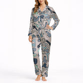 Women's pajama set with an all-over playful cartoon penis pattern in blue, grey, and teal colors on a light background, featuring a short-sleeve button-down top and matching shorts.