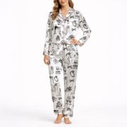 Women's pajama set featuring a black and white hand-drawn wedding doodle pattern with brides, grooms, cakes, rings, and champagne glasses on a white background, perfect for bridal loungewear.