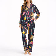 Women's navy blue pajama set with a cute softball and baseball pattern featuring bats, gloves, softballs, hearts, and bows, made from soft silky satin fabric.