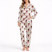 Women's pajama set featuring a festive pattern of espresso martinis with Santa hats and red bows, surrounded by coffee beans on a white background.