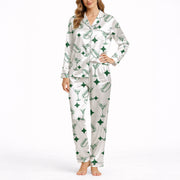 White pajama set with green hot dog, martini glass, and diamond pattern, short sleeve button-down top and shorts, soft silky satin fabric.