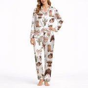 Women's white pajama set with a cute cowgirl print featuring pink bows, cowboy boots, Highland cows, and cacti, made from soft silky satin fabric.
