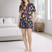 Women's navy blue pajama set with a cute softball and baseball pattern featuring bats, gloves, softballs, hearts, and bows, made from soft silky satin fabric.