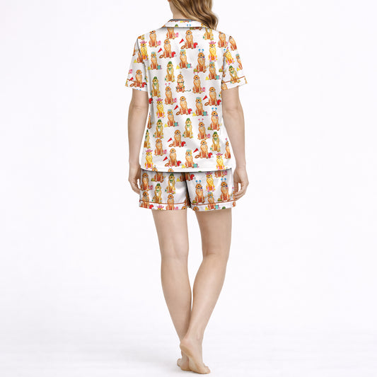Women's pajama set featuring an all-over print of cute Golden Retrievers in various festive and seasonal outfits, on a white background.
