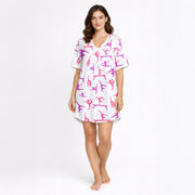 Women's pajama set featuring a vibrant pink and purple gymnast silhouette pattern on a white background, showcasing various athletic poses.