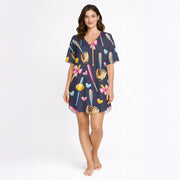 Women's navy blue pajama set with a cute softball and baseball pattern featuring bats, gloves, softballs, hearts, and bows, made from soft knit fabric.