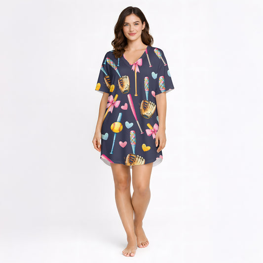 Women's navy blue pajama set with a cute softball and baseball pattern featuring bats, gloves, softballs, hearts, and bows, made from soft knit fabric.