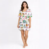 Women's pajama set featuring a vibrant watercolor Italian travel pattern with Pisa, Colosseum, Vespa, gondola, pizza, pasta, wine, and gelato on soft knit fabric.