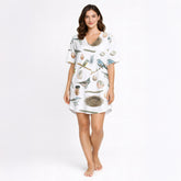 Women's short sleeve button down pajama set with shorts featuring a beautiful watercolor bird, nest, and egg pattern on white knit fabric.