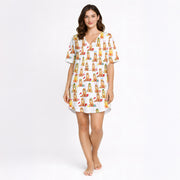 Women's pajama set featuring an all-over print of cute Golden Retrievers in various festive and seasonal outfits, on a white background.