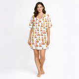 Women's pajama set featuring an all-over print of cute Golden Retrievers in various festive and seasonal outfits, on a white background.