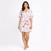 Women's Mother of the Bride pajama set with red hand-drawn wedding motifs on white fabric, including ballet slippers, champagne flutes, doves, and hearts.