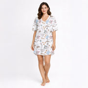 Women's baking-themed pajama set featuring cute illustrations of stand mixers, cupcakes, cookies, and baking tools in pastel colors on a white background.