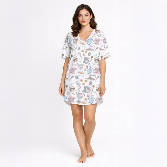 Women's baking-themed pajama set featuring cute illustrations of stand mixers, cupcakes, cookies, and baking tools in pastel colors on a white background.