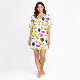 Women's pajama set featuring a white background with a colorful softball-themed pattern including softballs, bats, helmets, gloves, home plates, and female players.