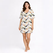 Women's pajama set featuring a fun and whimsical pattern of cute corgi dogs, wine bottles, wine glasses, beer glasses, and martini cocktails on a white background, perfect for pet lovers and relaxation.