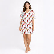 Women's pajama set featuring a festive pattern of espresso martinis with Santa hats and red bows, surrounded by coffee beans on a white background.