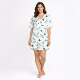 White pajama set with green hot dog, martini glass, and diamond pattern, short sleeve button-down top and shorts, soft knit fabric.
