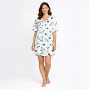 White pajama set with green hot dog, martini glass, and diamond pattern, short sleeve button-down top and shorts, soft knit fabric.