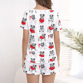 Women's pajama set with a repeating pattern of cute cartoon bulldogs wearing red sweaters on a white background, perfect for dog lovers.