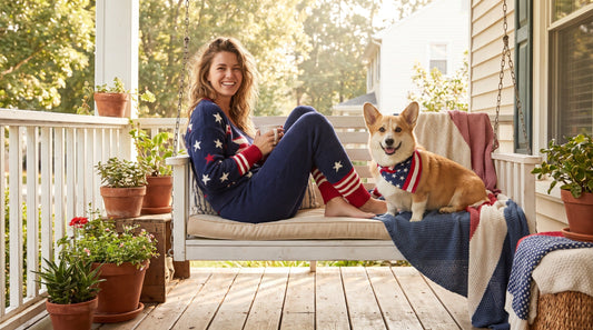 Woman in patriotic matching pajama set with corgi dog in coordinating bandana for summer