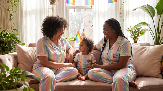 Queer family wearing Pride matching AOP sets with Mama Bear Papa Bear Little Cub designs