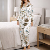 Women's short sleeve button down pajama set with shorts featuring a beautiful watercolor bird, nest, and egg pattern on white knit fabric.