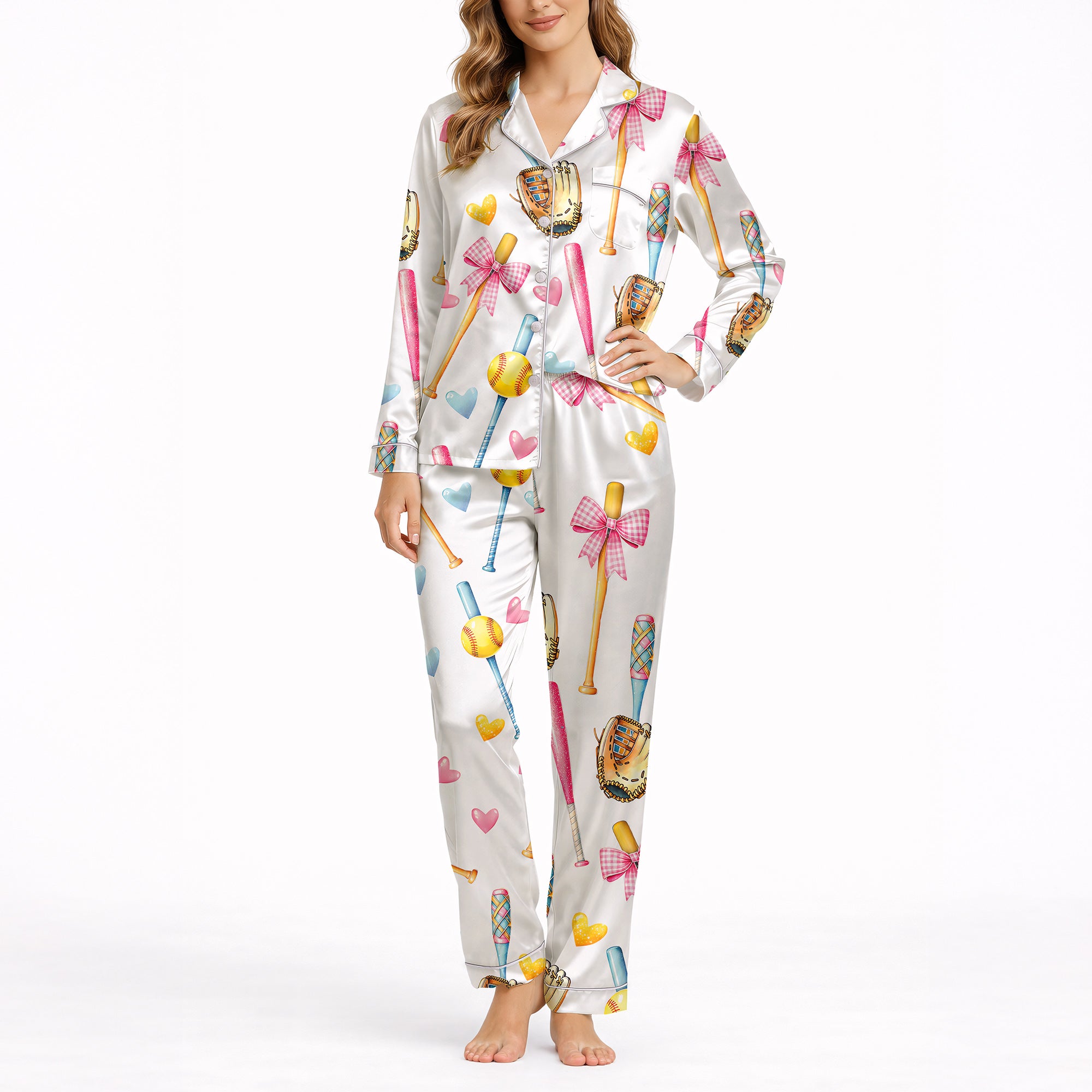Women's pajama set featuring a cute watercolor print of pink and blue baseball bats, yellow softballs, brown gloves, and scattered hearts on a white background.