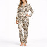 Women's short sleeve pajama set with a cozy pattern of books, coffee cups, eyeglasses, and flowers in warm brown and beige tones, perfect for reading and relaxation.