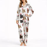Women's white knit pajama set with an all-over Christmas print of curly-haired dogs wearing Santa hats and tangled in colorful string lights.