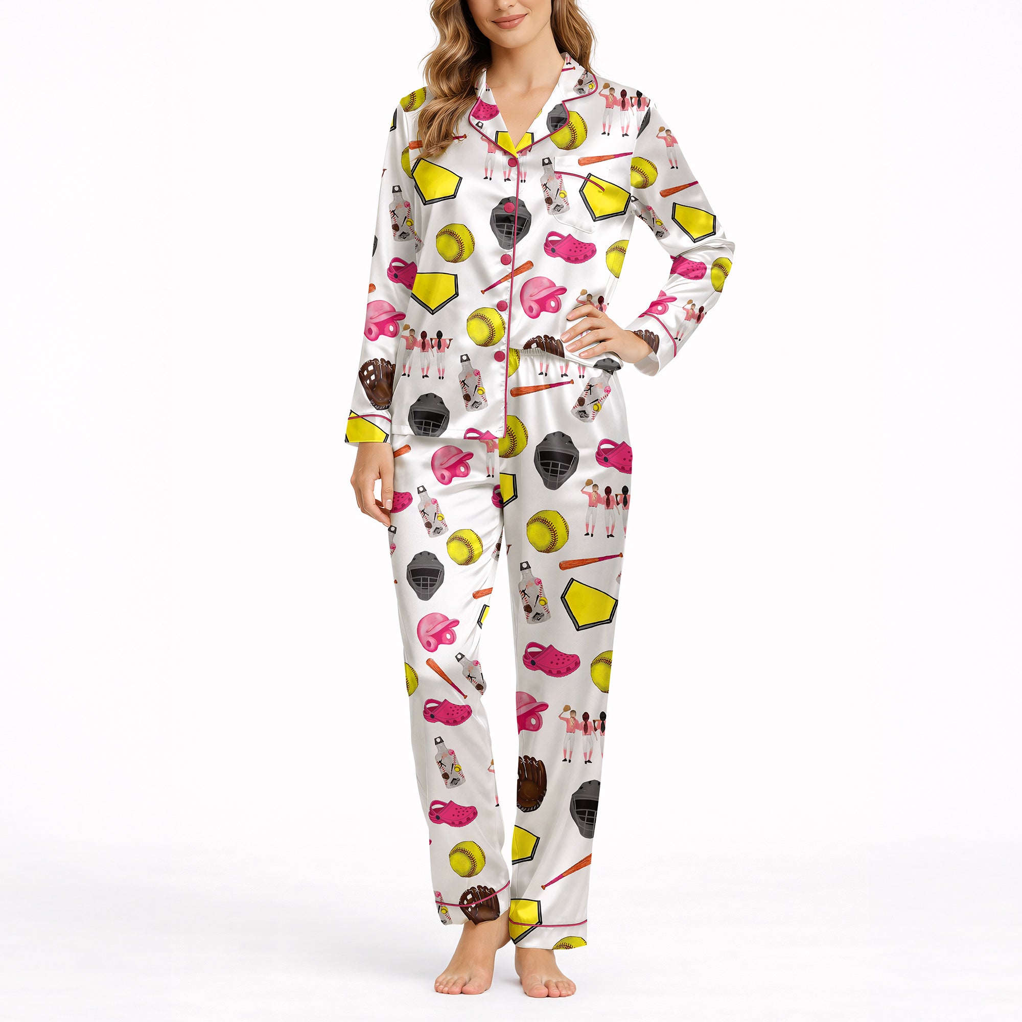 Women's pajama set featuring a white background with a colorful softball-themed pattern including softballs, bats, helmets, gloves, home plates, and female players.
