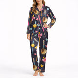Women's navy blue pajama set with a cute softball and baseball pattern featuring bats, gloves, softballs, hearts, and bows, made from soft knit fabric.