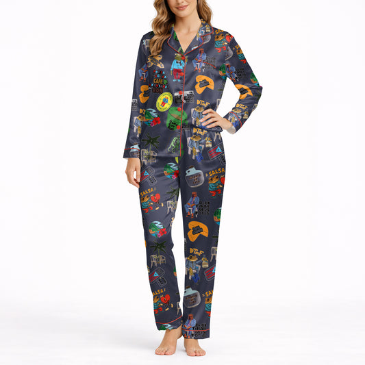 Women's pajama set with a vibrant Caribbean-themed pattern featuring Coquí frogs, Salsa hearts, Puerto Rico flag, coffee and rum drinks, palm trees, and cameras on a dark blue background.