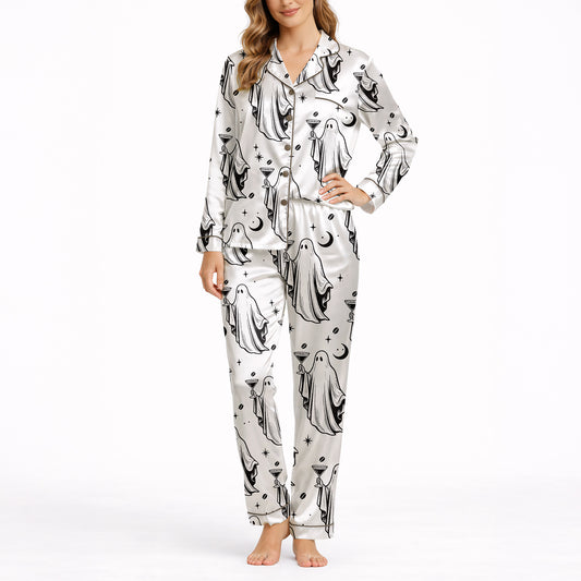Women's pajama set with a playful black and white ghost pattern, featuring ghosts holding coffee and cocktail glasses, moons, stars, and coffee beans, perfect for comfortable sleepwear.