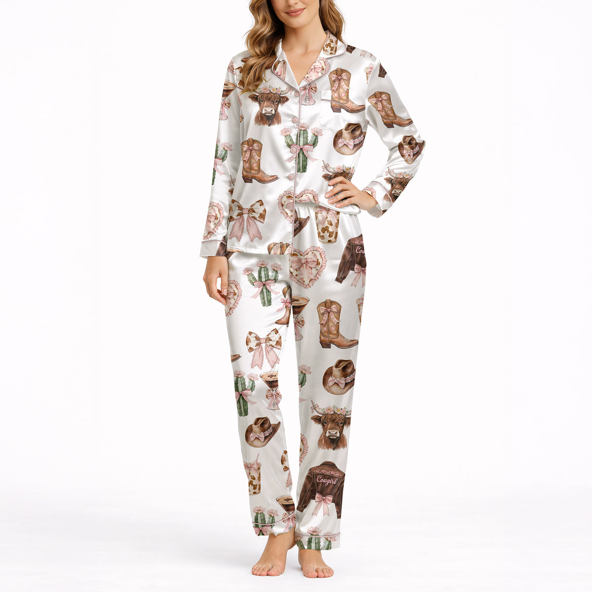 Women's white pajama set with a cute cowgirl print featuring pink bows, cowboy boots, Highland cows, and cacti, made from soft knit fabric.