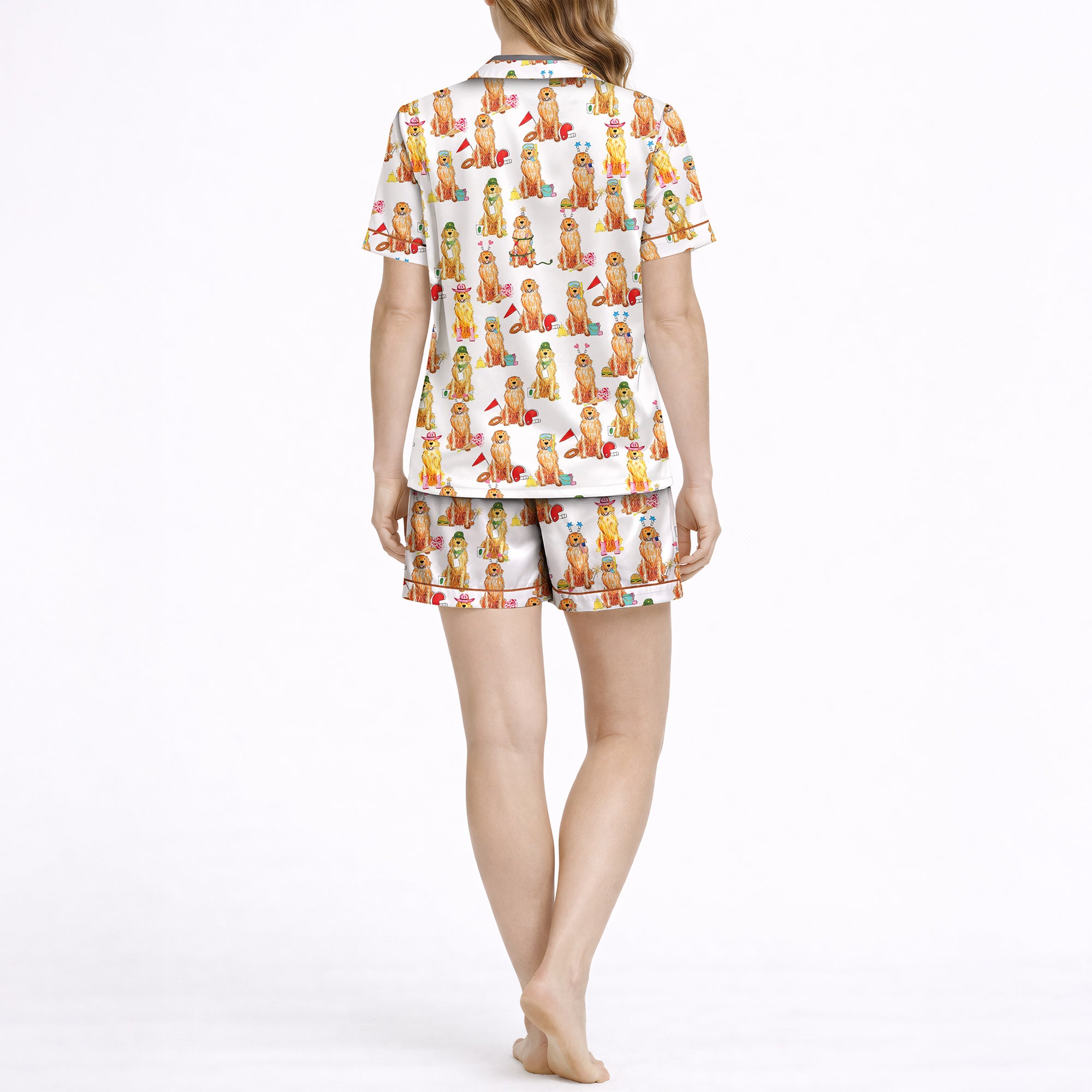 Women's pajama set featuring an all-over print of cute Golden Retrievers in various festive and seasonal outfits, on a white background.