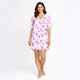Women's pajama set featuring a vibrant pink and purple gymnast silhouette pattern on a white background, showcasing various athletic poses.