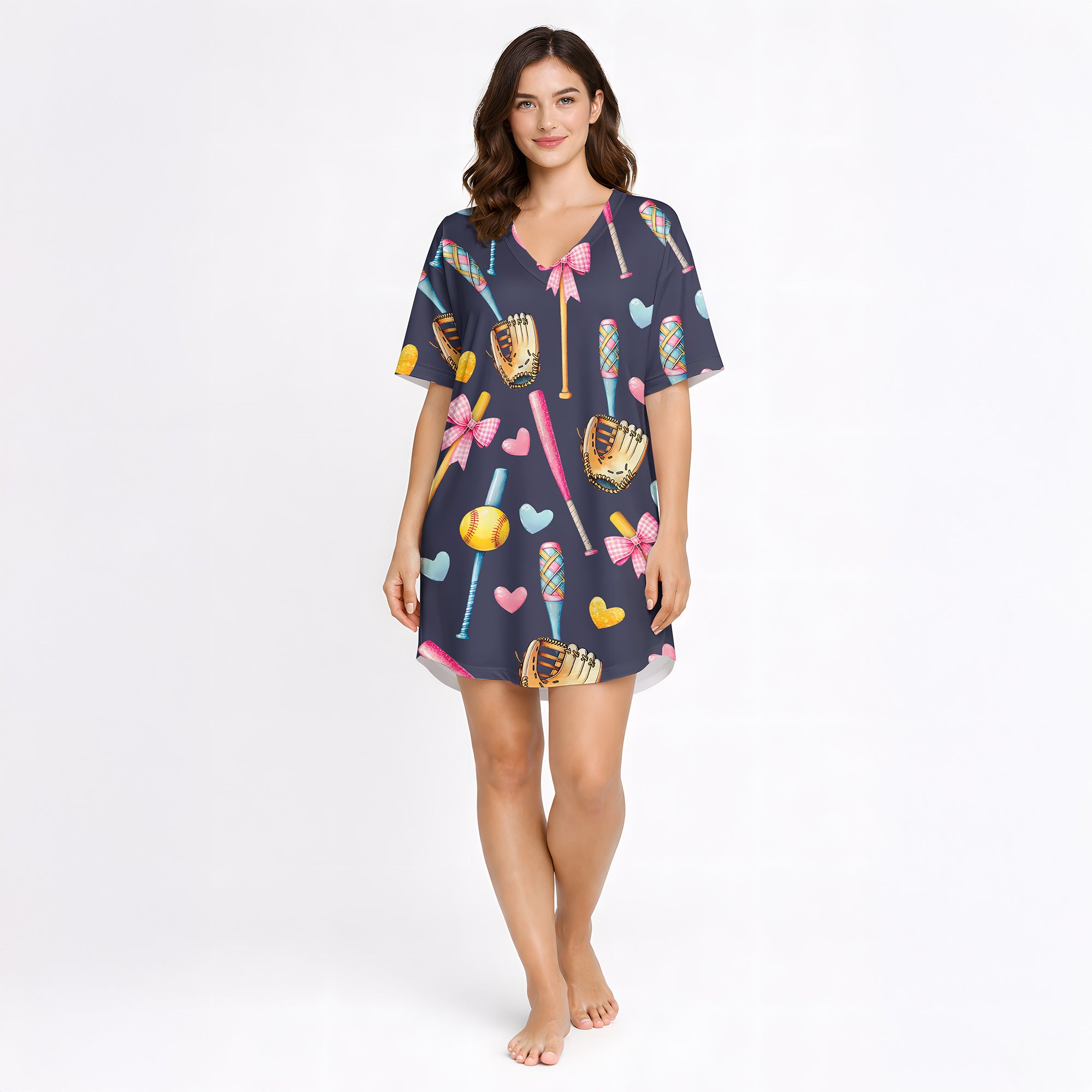 Women's navy blue pajama set with a cute softball and baseball pattern featuring bats, gloves, softballs, hearts, and bows, made from soft knit fabric.
