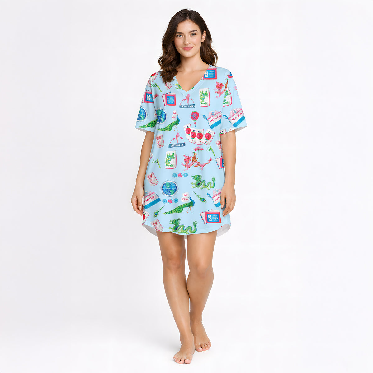 Women's pajama set with whimsical Eastern charm pattern featuring green dragons, pink dragons, peacocks, Mahjong tiles, and 'Charleston' text on a light blue background.