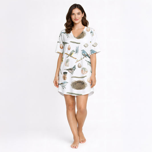 Women's short sleeve button down pajama set with shorts featuring a beautiful watercolor bird, nest, and egg pattern on white knit fabric.