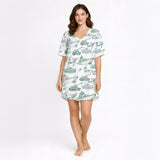 Women's pajama set featuring a unique green sketch pattern of military vehicles including tanks, warships, fighter jets, and helicopters on a white background, perfect for comfort and style.