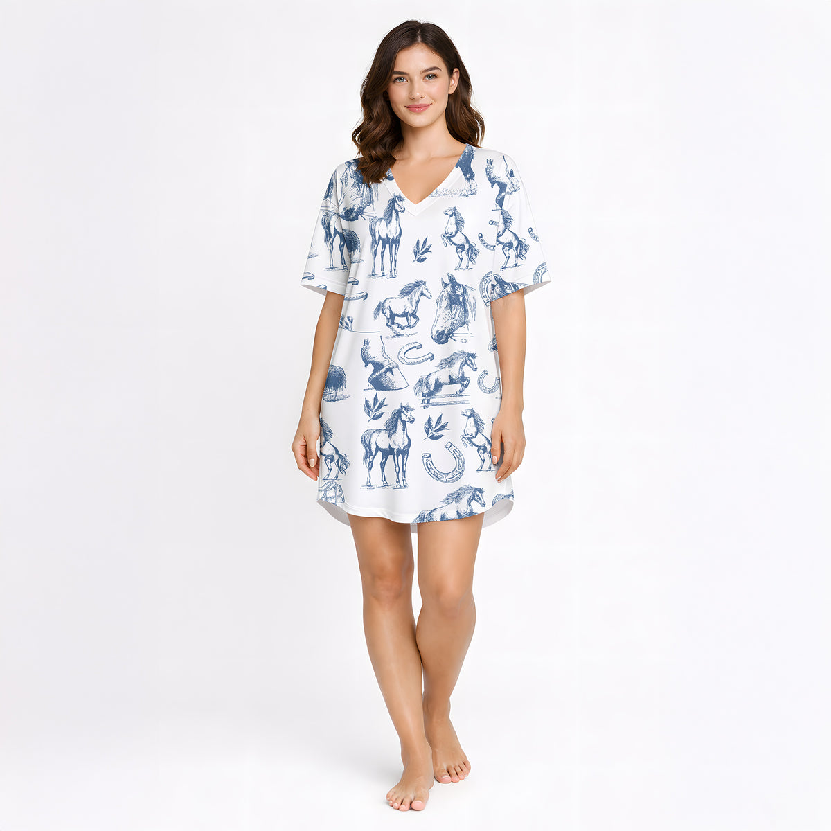 Women's pajama set with a blue sketch-style pattern of horses, horseshoes, and saddles on a white background, made from soft knit fabric.