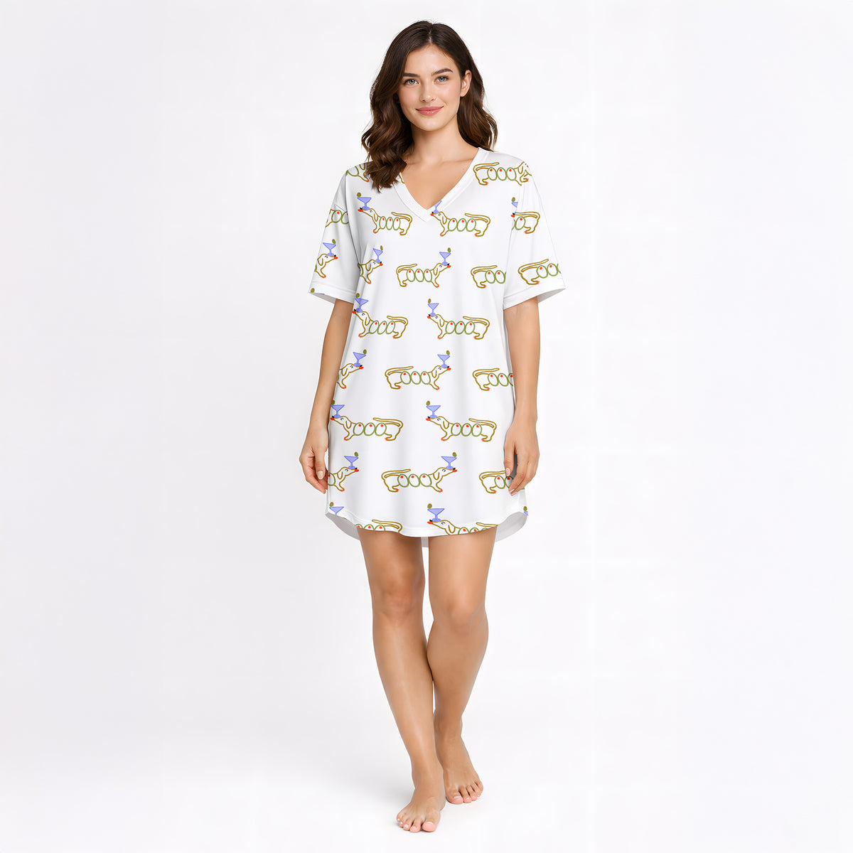 White pajama set with short sleeve button down top and shorts, featuring a playful pattern of cartoon dachshund dogs, some holding blue martini glasses, and the word 'GOOD' stylized as a dog, with green piping.