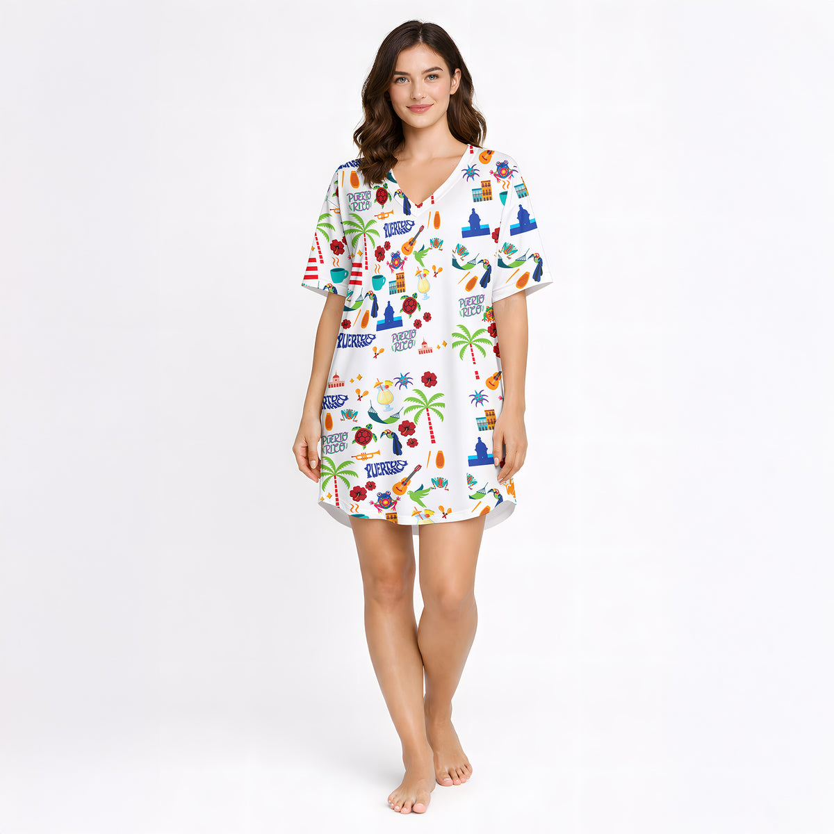 Women's pajama set featuring a vibrant Puerto Rico themed print with the flag, coqui frogs, palm trees, hibiscus flowers, and El Morro, on a white background.