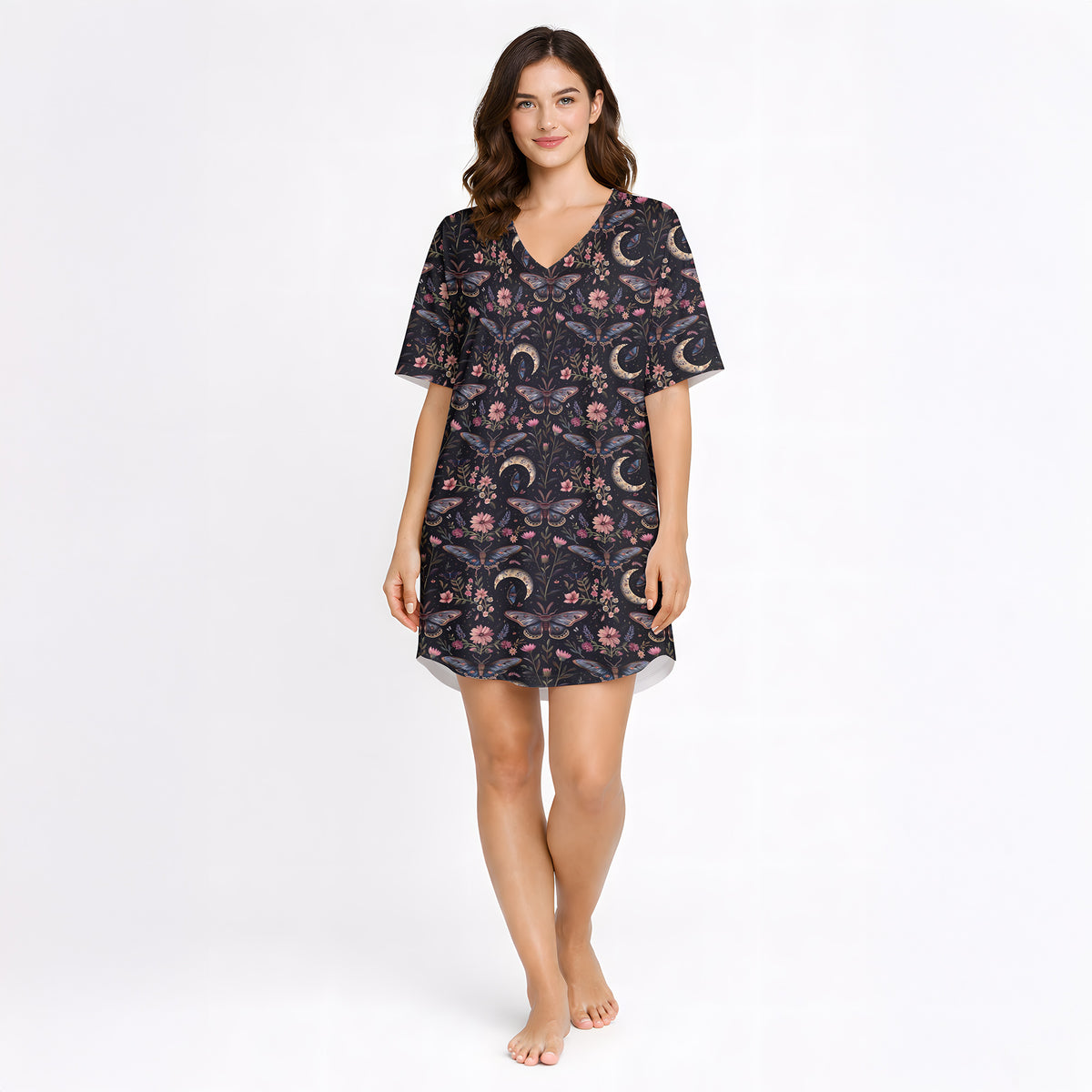 Women's short sleeve button down pajama set with shorts featuring a dark celestial and botanical print of moths, crescent moons, and pink flowers on a black background.