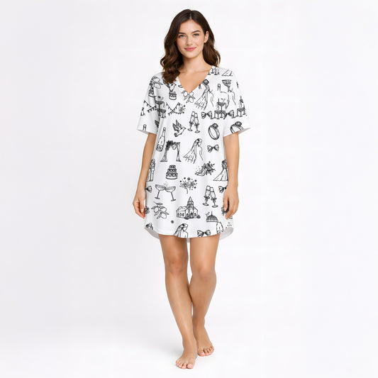 Women's pajama set featuring a black and white hand-drawn wedding doodle pattern with brides, grooms, cakes, rings, and champagne glasses on a white background, perfect for bridal loungewear.